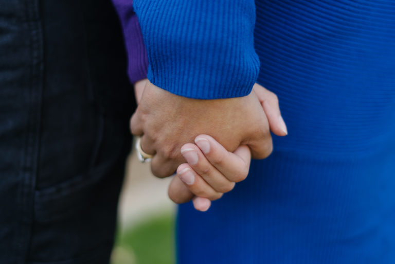 close up of mother holding teenage daughter's hand